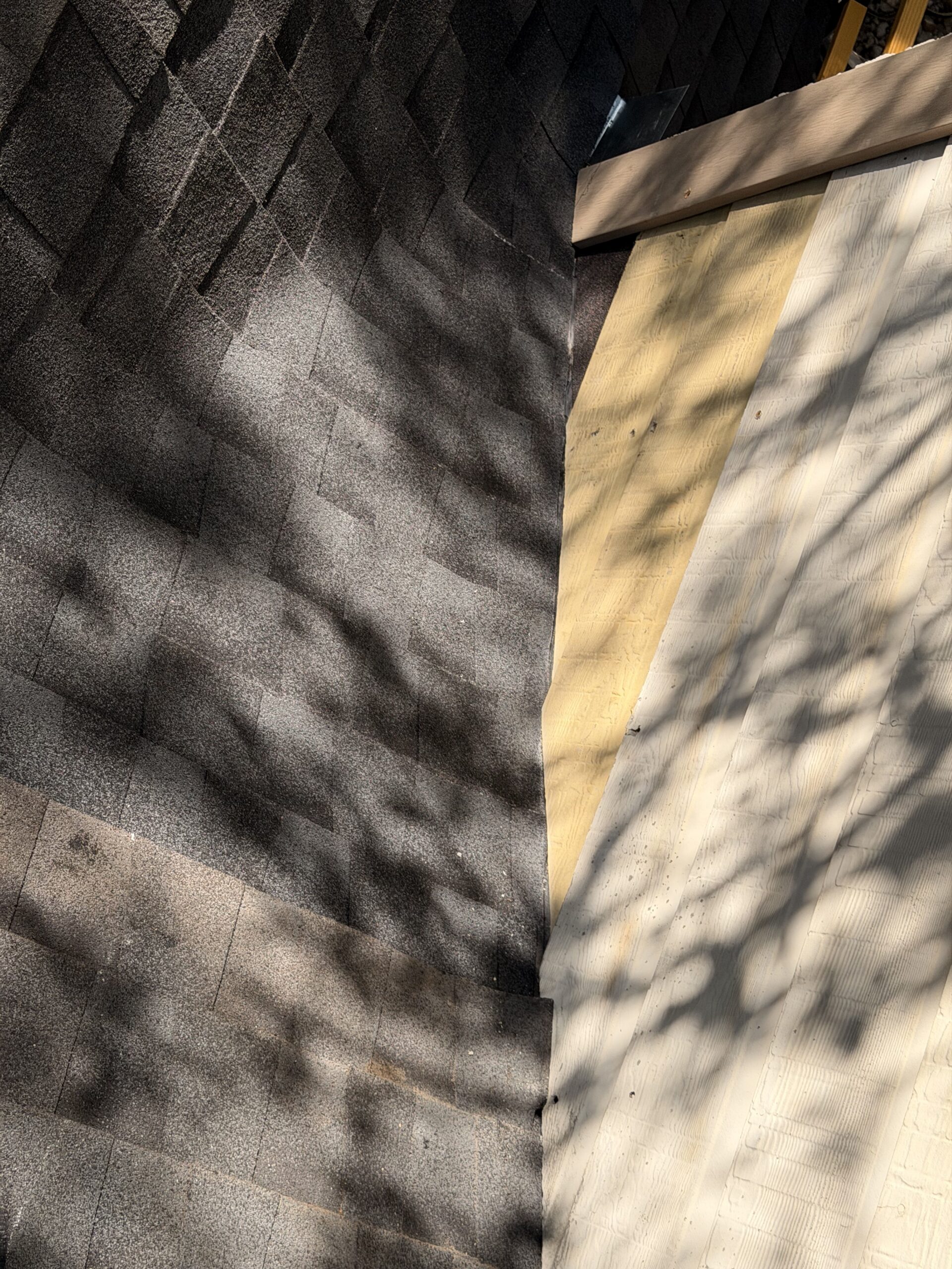 Completed sidewall flashing, shingle and valley repair on a residential roof in San Antonio, TX