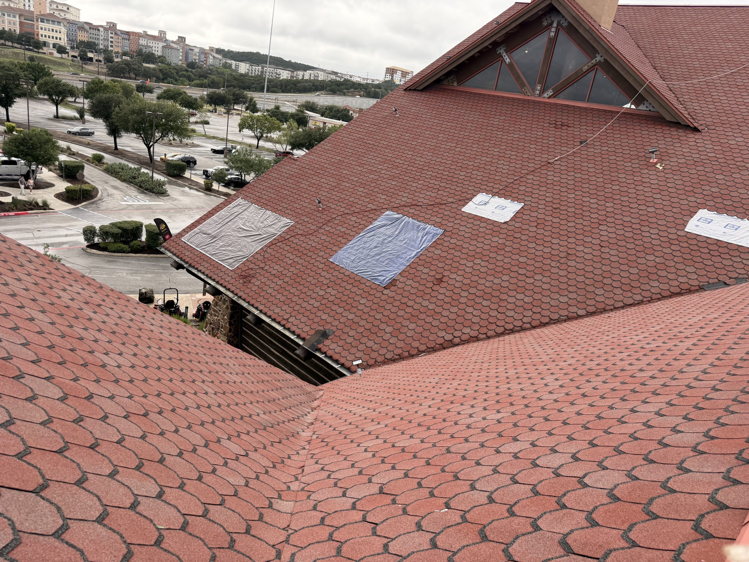 Emergency temporary roof protection installed on a storm-damaged commercial roof in San Antonio, TX
