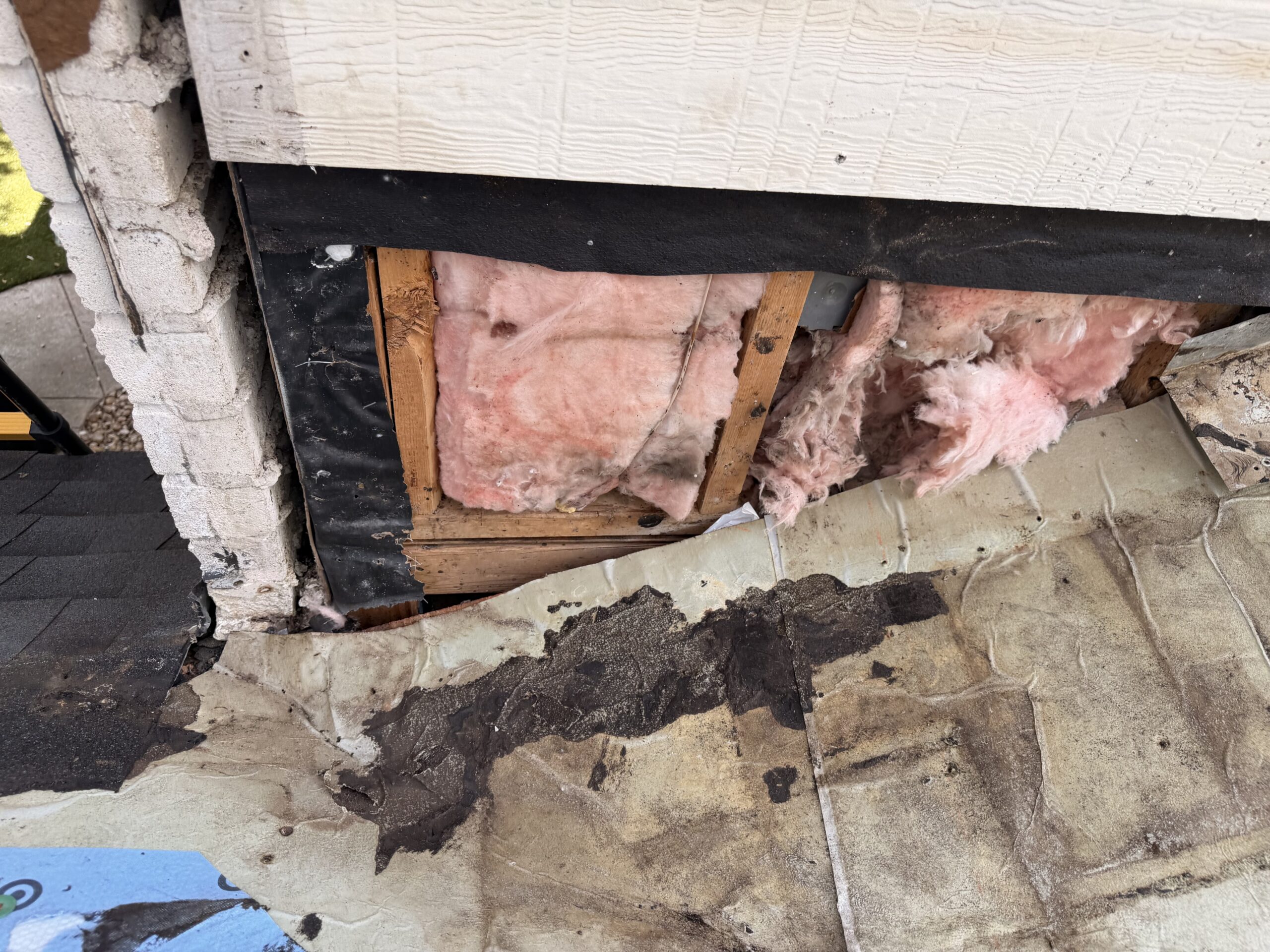 Exposed sidewall and valley area during flashing repair in San Antonio, TX