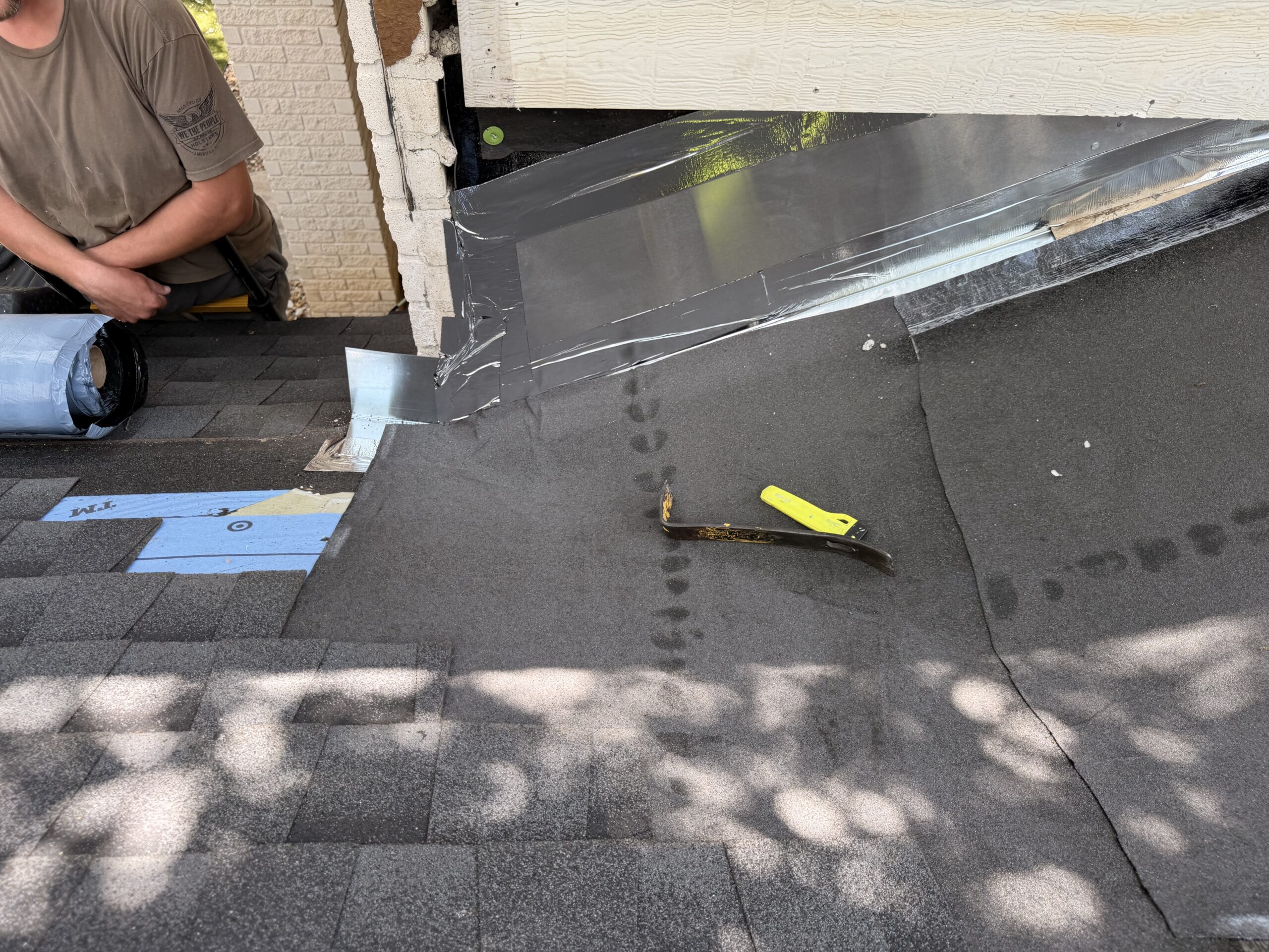 New sidewall flashing and waterproofing being installed during San Antonio roof repair