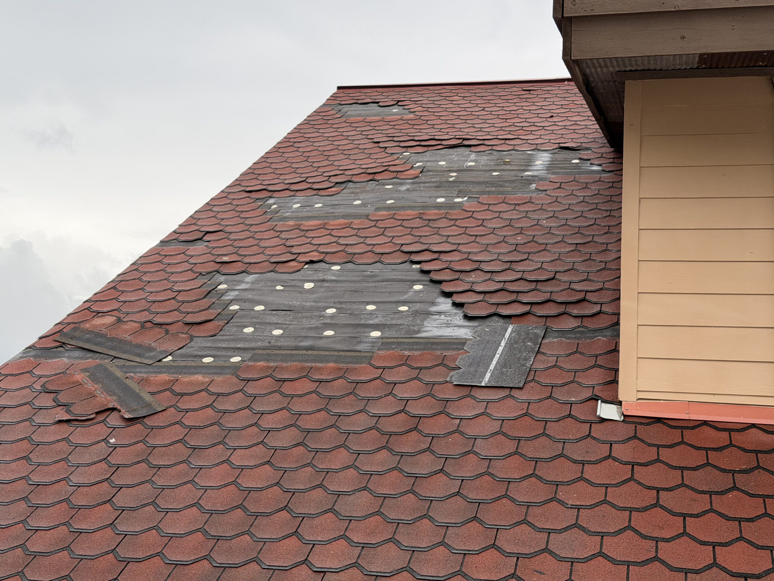 Compromised commercial roofing area before emergency temporary dry-in in San Antonio, TX