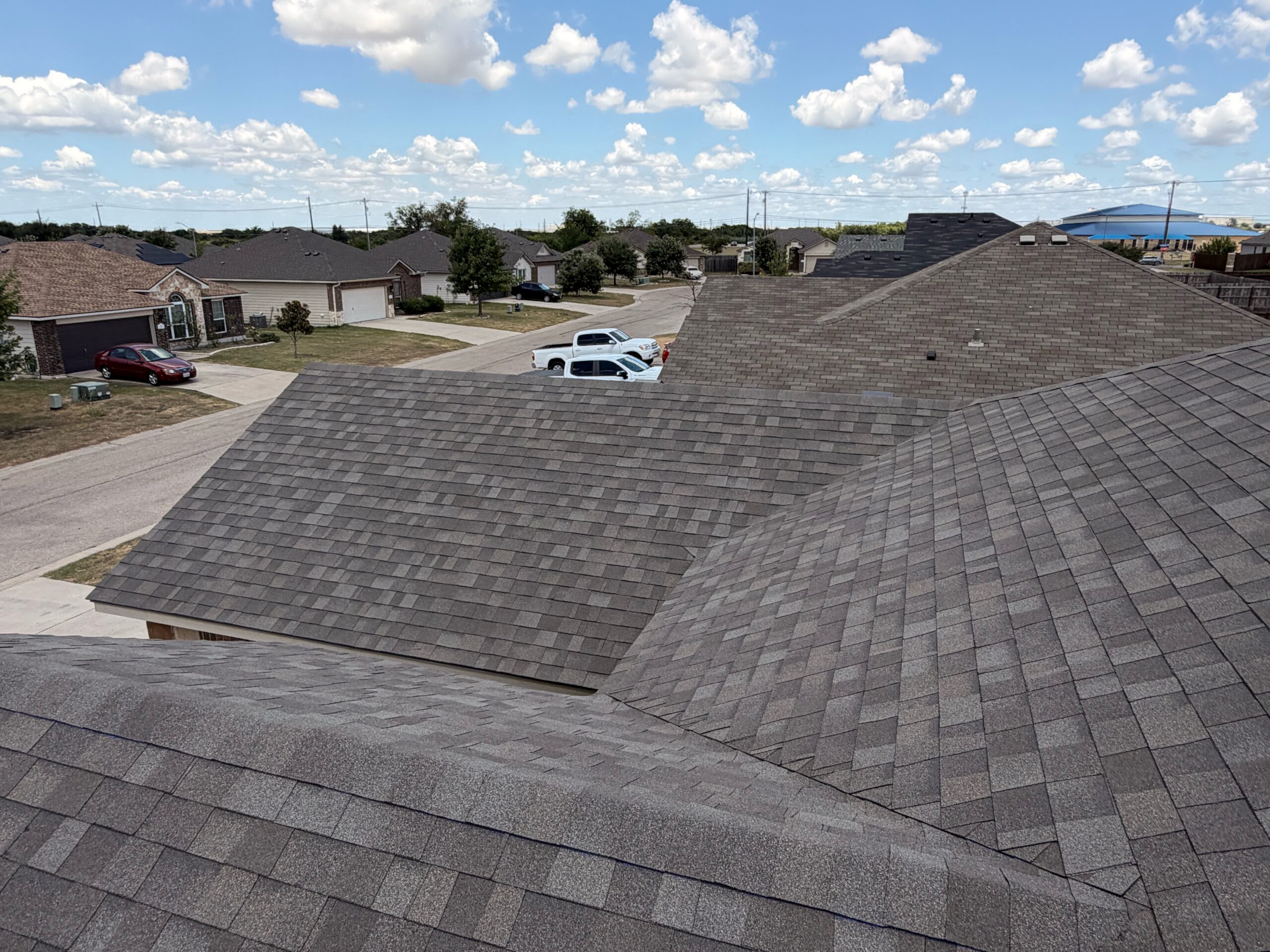 Completed Owens Corning Oakridge Driftwood shingle roof replacement in Temple, TX
