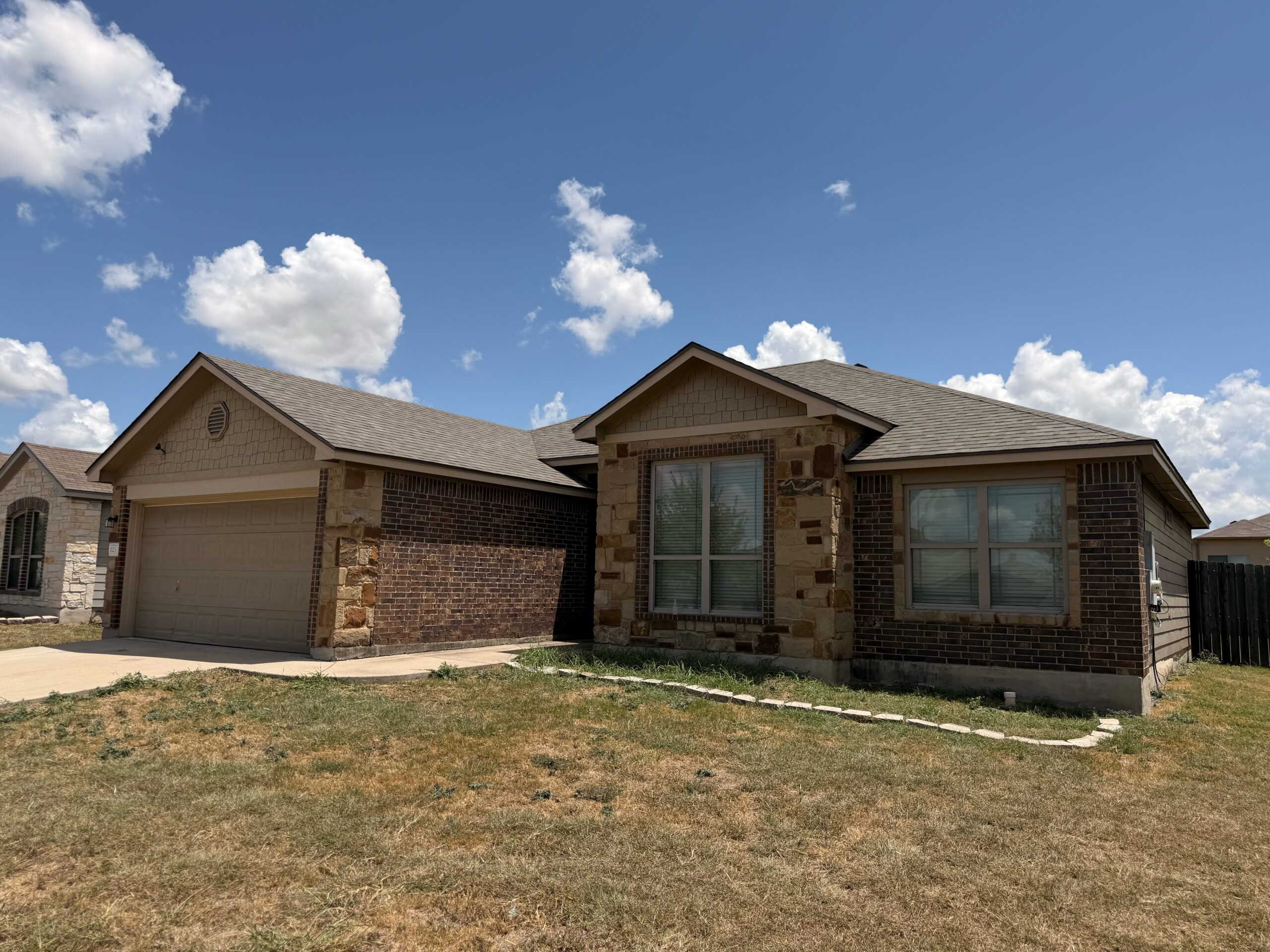 Finished residential roof replacement following hail damage in Temple, TX